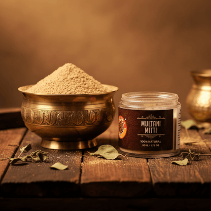 Multani Mitti powder in a brass bowl with a jar labeled 'Multani Mitti' on a wooden surface.