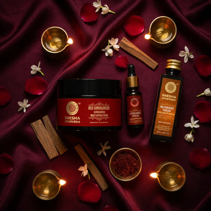 Shesha Ayurveda Night Goddess Kit flat lay with brass diyas, rose petals and saffron