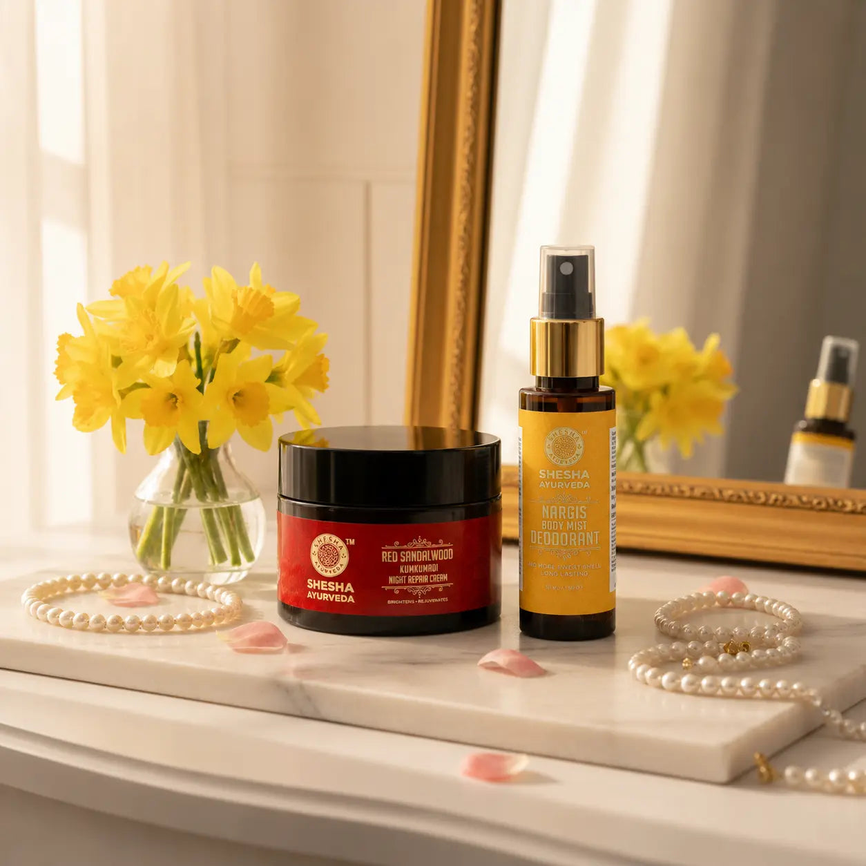 Shesha Ayurveda Bloom & Glow Kit – Red Sandalwood Night Cream and Nargis Body Mist on a marble vanity tray with Nargis flowers and roses